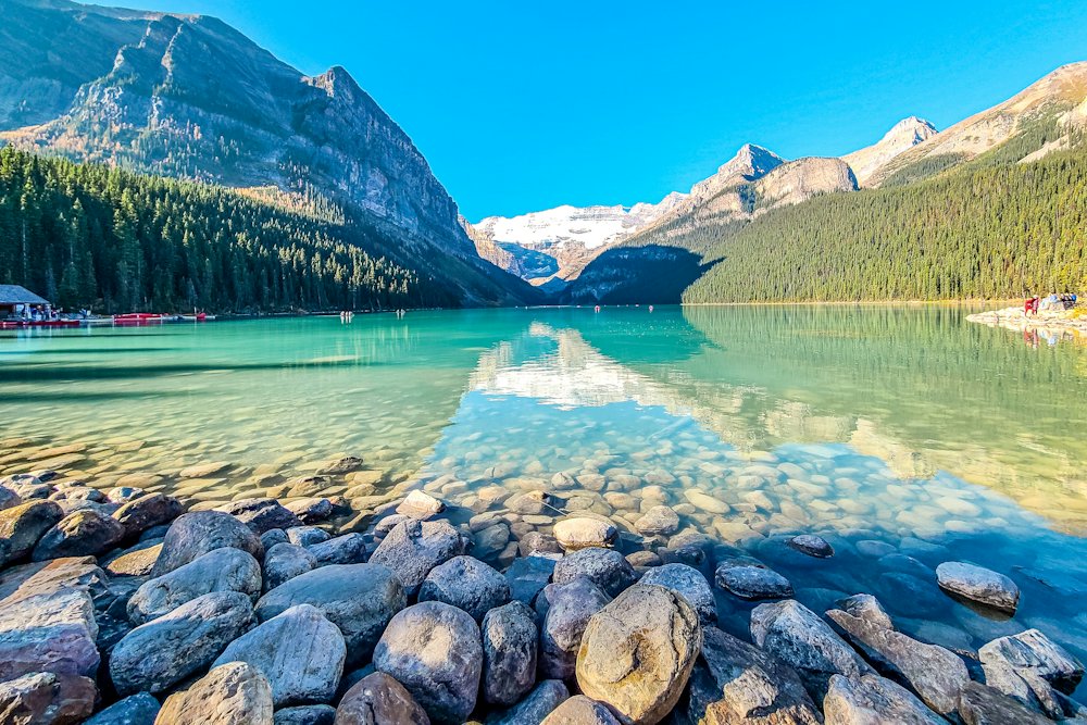 Turquoise lake beneath snow-capped peaks in the Canadian Rockies